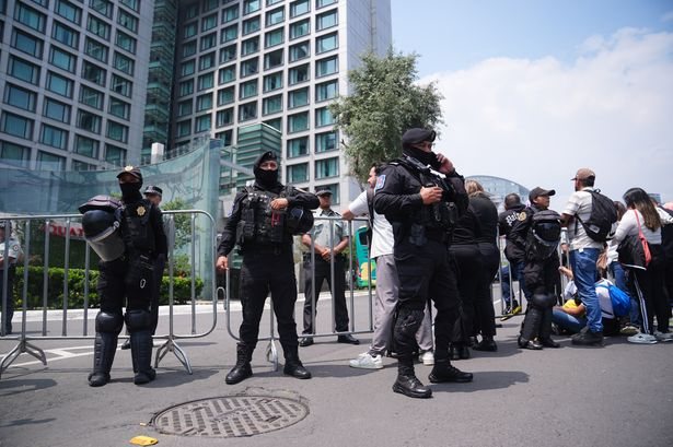 Riot police guard England hotel as Mexico fans protest ahead of World Cup clash