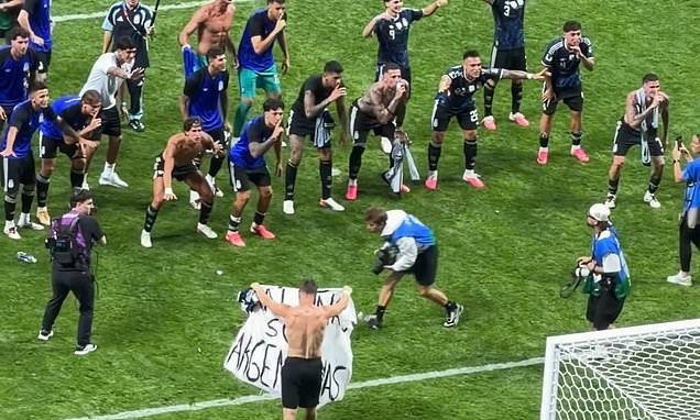 Argentina players celebrate World Cup win over England with Falklands banner